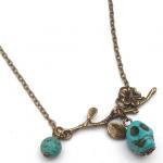 Antiqued Brass Branch Turquoise Skull Necklace