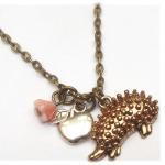 Antiqued Brass Hedgehog Allpe Flower Necklace
