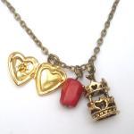 Antiqued Brass Locket Carrousel Coral Necklace
