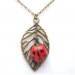 Antiqued Brass Leaf Porcelain Ladybug Necklace