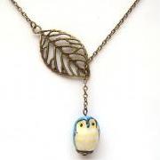 Antiqued Brass Leaf Blue Owl Necklace